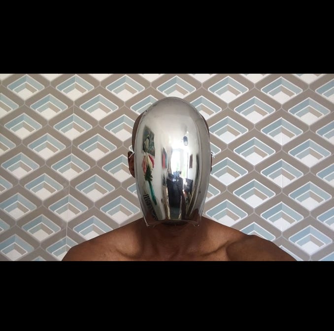 Creative art project photograph, man with no face, silver mask image