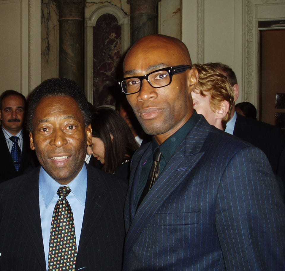 Brazil World Cup legend Pele and Gloria Books editorial director Ben Arogundade, at the launch of Pele's illustrated biography, London 2009.